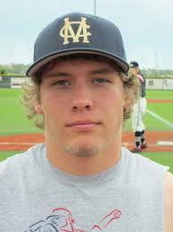 Mustangs' Guenther fires his gun from behind the plate