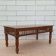 Generally the rule is that your coffee table should be the same height as your couch's seat (give or take one to two inches, but not any lower). Girli Traditional Coffee Table Natural Color