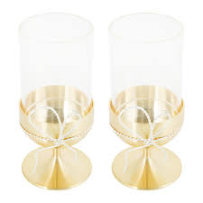 Shipping is always free and returns are accepted at any location. Vera Wang Love Knots Gold Taper Candle Holder Pair