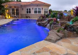 Ever considered adding a pool slide to your swimming pool at home? Rock Waterfalls Slides And Grottoes Alan Smith Pools