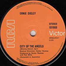 Around the time john was appearing on the ernie sigley show. City Of The Angels What A Beautiful World By Ernie Sigley Single Reviews Ratings Credits Song List Rate Your Music