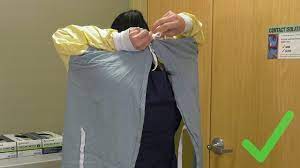 The top set of laces on most hospital gowns sit right behind your neck, just. Donning And Doffing Isolation Gowns Youtube