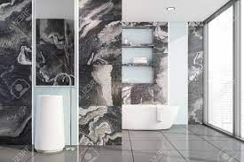 A minimalist space done with white marble, a large lit up a statement contemporary bathroom all done with white and black marble on the walls, in the shower space and with marble shelves. Interior Of Luxury Bathroom With Black Marble Walls Tiled Floor Stock Photo Picture And Royalty Free Image Image 124974981