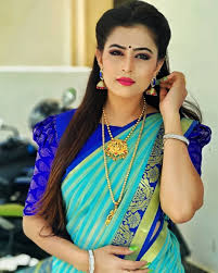 In A Cyan Green Color Stripes Saree And Puff High Neck Elbow Length Sleeve Blouse Design Blouse Hand Designs Fancy Blouse Designs Bridal Blouse Designs You can look really gorgeous as the blouse design is really attractive which it is again going to be a great design if the lady is not willing to go for exclusively simple variety of blouse with the saree that is been worn. neck elbow length sleeve blouse design