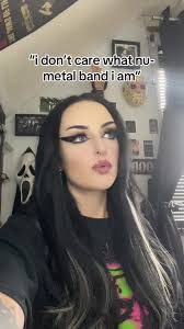 Emo Alternative Girl with Piercings and Tattoos