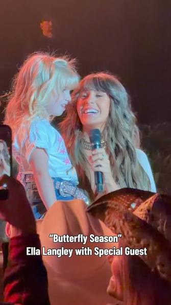 ellalangleymusic made a young fan's dream come true! 🥹❤️ During her Sept.  12 sold-out show, Langley spotted Emily's sign asking, “I'm Little Miss  2026, but I just want to be YOU! Can