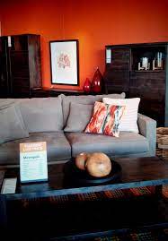 Orange Wall Dark Woods Grey Couch White Accessories Gray Living Room Design Living Room Orange Living Room Grey