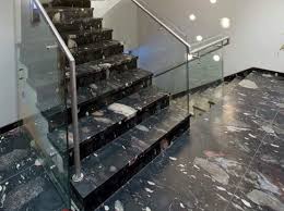 White cabinets with dark granite. Pebble Black Granite Exporters Exotic Stone India