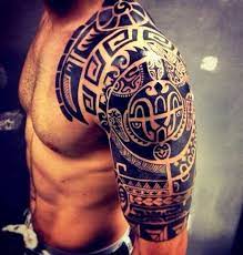 The arm clock adds an interesting twist to the image. 54 Hunky Bicep Tattoos For Men To Look Gallant And Fearless