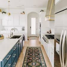 Teal Cabinets And Mixed Metals Add Depth And Color To Brns Design S Bright White Kitchen Featuring The Solna Kitchen Black Kitchens Kitchen Colors Red Kitchen