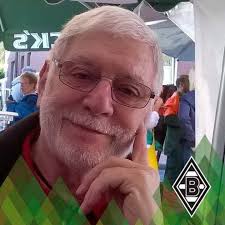 A British Army Chaplain presides over the burial of a fallen soldier from  the 7th Armoured Division in a roadside grave as Stuart light tanks from  8th Hussars Recce Troop continue the
