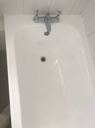 Remove all the rust repair all chips repair any other damage or surface imperfections prepare the surface apply a new enamel coating to the bathtub. Bath Re Enamelling Resurfacing Bath Shower Worktop Repair London