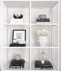 Against a wall with dark paint or wall paper, these shelves will create stylish accents in the living room, in the. Monochrome Styling With Meg Quinn Front Main White Bookshelf Decor White Bookshelves Black And White Decor