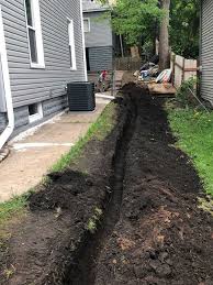 Pick a building material that will work with the look and feel of your yard. Outdoor Drainage Project Retaining Wall In Small Backyard Kg Landscape Management
