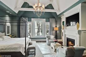 The Master Suite Boasts A Green With White Accent Along With A Fireplace Just Below Of A Wide Luxury Bedroom Master Large Master Bedroom Ideas Bedroom Layouts