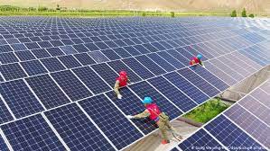 A device that utilizes solar energy (e.g. How Many Solar Panels Do We Need To Save The Climate Business Economy And Finance News From A German Perspective Dw 06 01 2021