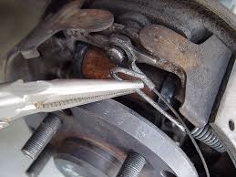 Use a screwdriver to attach the brake drum puller's. Jeep Rear Drum Brake Remove Install And Adjust