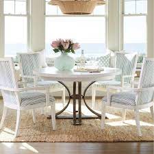 Browse a large selection of coastal dining room chairs, including metal, wood and upholstered dining chairs in a variety of colors for your kitchen or dining area. White Painted Wood And Dark Burnished Pewter Make For A Very Modern Take On Coastal Style With The S Round Dining Table Casual Dining Room Tables Dining Table