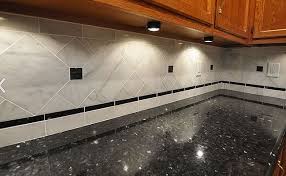 The backsplash uses two of the tile designs. Backsplash Com Kitchen Backsplash Tiles Ideas Countertop Backsplash Countertop And Backsplash Ideas Kitchen Backsplash Photos