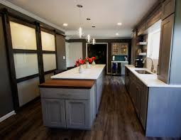 The shallow flat area of the pool serves as either a kiddie pool or a great place to put your beach lounges in the water. Eight Eye Catching Kitchen Islands Architectural Justice