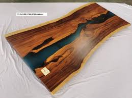 People love how a live edge slab looks with our epoxy showcasing the wood. China Live Edge Epoxy Resin Slab Table Natural Edge Slab Table One Piece Resin Wood Slab Single Piece Resin Wood Table China Table One Piece