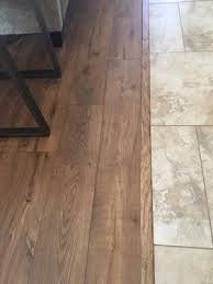 I paid over 20 thousand for new floors then 9 years later another 24 thousand to correct their installation. Pergo Max Premier Bourbon Street Oak 7 48 In W Embossed Wood Plank Laminate Flooring Lowes Com Flooring House Flooring Transition Flooring