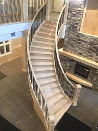 Metal balusters (spindles) provide a custom hand railing. Maple Curved Stair With Metal Spindles Ssr50 Spindle Stairs Railings