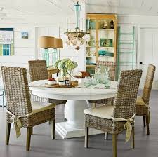 For dining room seating, a set of white wicker chairs give this space its modern coastal vibe. Rattan Chairs For Coastal Beach Style Living Coastal Decor Ideas Interior Design Diy Shopping