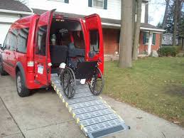 At the end of the ramp, construct a landing out of either concrete or the same materials as the ramp. Bi Fold Ramp Installed In Ford Transit Connect For Convenient Wheelchair Scooter Access Made From Aircra Disability Transportation Ford Transit Wheelchair Van