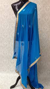 Depending on the occasion to wear a neat white kurtha or salwar and pair it with a kutch work dupatta to look peppy and youthful. Chiffon Dupatta With Mirror Work Blue Offwhite Orange Peach Sarang