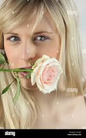 Woman rose in mouth hi-res stock photography and images