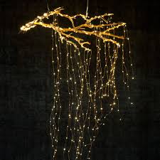 Create A Cascade Of Lights From A Suspended Branch 28 Breathtaking Ways To Decorate With Christmas Tree Branch Decor Holiday Lights Christmas Tree Lighting