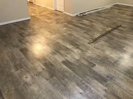 I definitely agree that vinyl is the way to go in a basement likely to flood, but your best options would require no glue at all. Waterproof Vinyl Flooring Basement Vinyl Flooring Online
