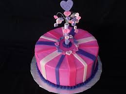 This free cake, decorated with icing, a border, and an inscription, is the baby's own cake to enjoy. Pink And Purple Cake For A 7 Year Old Little Girls Birthday Velvety Vanilla Cake With Traditional Buttercream Icing Fondant Stripes Gum Cakecentral Com