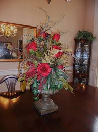 Accented with ivy in a lovely designer quality pedestal vase. Burkett Blessings Decorating With Floral Arrangements Table Floral Arrangements Dining Table Centerpiece Table Flower Arrangements