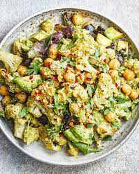 Deliciously Ella On Instagram Cauliflower Chickpea And Pesto Salad Tossed With Brown Rice Avocado And A Sq In 2021 Pesto Salad Deliciously Ella Roasted Cauliflower