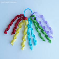 Use faultless premium spray starch to help ribbons keep their curl. Diy Curly Ribbon Hair Ties Ribbon Hair Ties Curly Ribbon Cheer Hair Bows