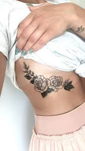 30 Delicate Flower Tattoo Ideas Flower Tattoo On Ribs Delicate Flower Tattoo Rib Tattoo