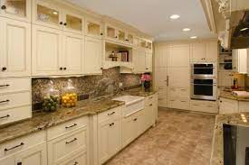 I'm in cabinetry myself and we just finished this kitchen with white cabinets and tan tiles. Seductive Galley Kitchen Off White Cabinets Design With Beige Granite Countertop And Beige Tile Bac Beige Kitchen Cream Kitchen Cabinets Kitchen Cabinet Design