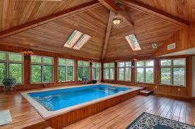 Maybe you would like to learn more about one of these? The Elevated Deck Gives A Fully In Ground Feel To This Partially In Ground Endless Pool For A Warm Airiness Witho Indoor Pool Design Endless Pool Pool Houses