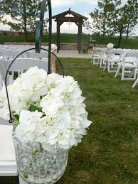 Hydrangeas In Jars On Shepherd S Hooks For An Outdoor Wedding Outdoor Wedding Wedding Outdoor Gardens