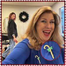 Today's #holidaypinoftheday photo is happening at the salon! Proposing  provocatively in the background is the artist who has been making my mane  marvelous for 15 years. Thank you @alialloway ! Candy cane