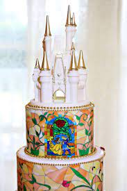 White Chocolate Castle Cake Topper With Gold Accents On Nicole Nick S Beauty And The Beast Themed Disney Castle Cake Topper Disney Cakes Disney Wedding Cake