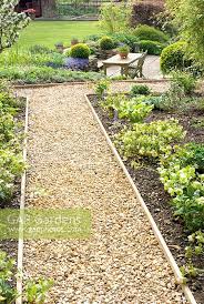 This gravel garden path idea from 'the gardener of good and evil' shows you just how to make a stable diy garden path. Gravel Path And Bord Stock Photo By Fiona Lea Image 0254114