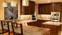 Brown Kitchen Cabinets With Black Countertops
