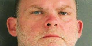 Man charged with keeping mother's body under tarp in front yard