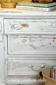 Mustard window a mustard hue window serves as a bridge between the surrounding environment and the black metal grill. 10 Heavily Distressed Chippy Furniture Pieces So Much Better With Age