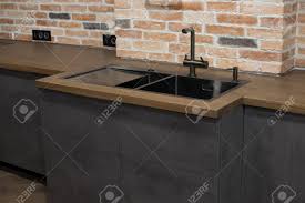 black sink, kitchen faucet