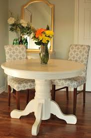 Available in a range of sizes, our kitchen and dining room tables can seat as few or as many as you like—from the cozy table tucked in the corner of your kitchen to the extension table with leaf that easily seats up to ten guests. A Place Of Gratitude Painted Pedestal Table Painted Pedestal Tables Pedestal Table Dining Table Makeover