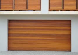 The next three photographs show two single car garage doors i painted to look like wood. Timber Look Garage Doors